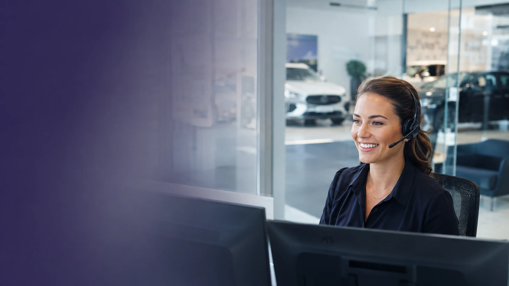 An Indigo Business Development Centre agent managing dealer enquiries by phone